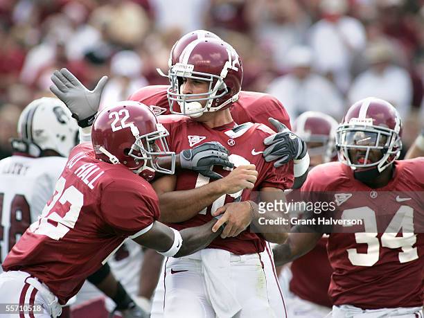 Quarterback Brodie Croyle of the Alabama Crimson Tide is congratulated by teammates after rushing for a 15-yard touchdown in the first quarter...