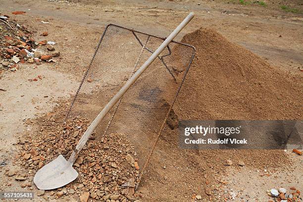 shovel, sieve and heap of sand - sieve stock pictures, royalty-free photos & images