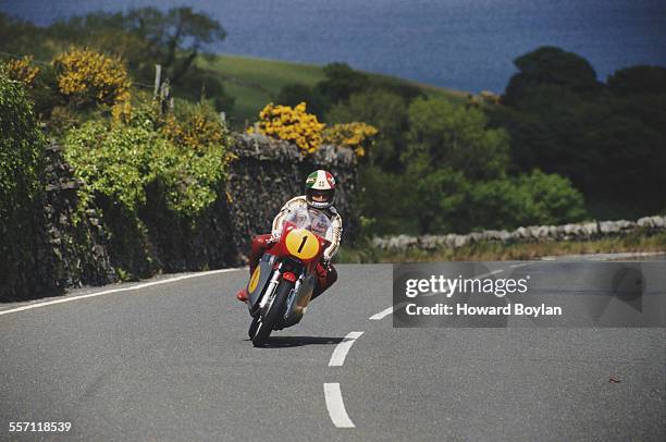 Giacomo Agostini of Italy rides his MV Agusta 350 cc motorcycle at the TT Race meeting on 7th June 1991 on the roads around Douglas on the Isle of...