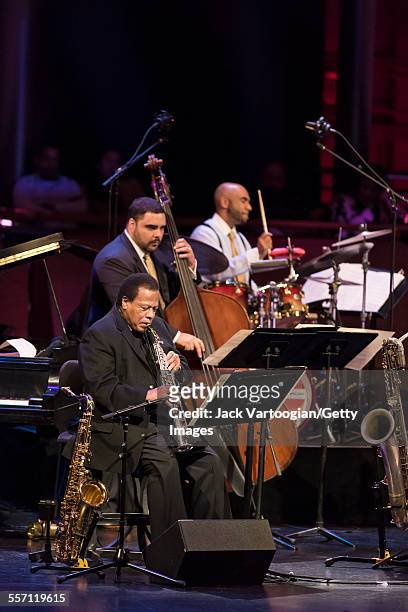 American Jazz composer and musician Wayne Shorter, on soprano saxophone, performs with Carlos Henriquez, on upright acoustic bass, Ali Jackson on...