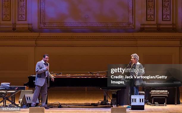 American Jazz musicians Herbie Hancock and Chick Corea greet the audience at the beginning of their duo piano concert at Carnegie Hall, New York, New...