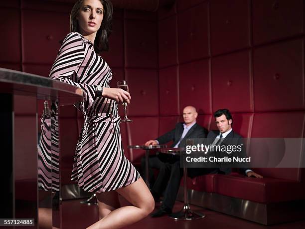 men looking at femme fatale in bar - femme bar cuisine stock pictures, royalty-free photos & images