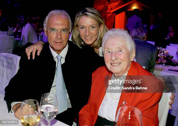 Franz Beckenbauer, his partner Heidi Burmester and his mother Antonie Beckenbauer pose for a photo at the Arabella Sheraton Hotel on September 17,...