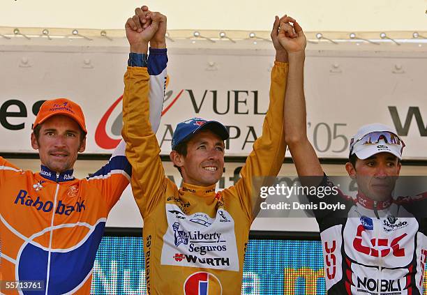 Roberto Heras Denis Menchov and Carlos Sastre, placed 1st, 2nd and 3rd respectevely, celebrate on the podium after the last stage of the Tour of...