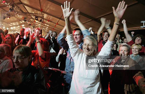 Supporters of the party "Die Linke" cheer at the Left's election party on September 18, 2005 in Berlin, Germany. As 62 million Germans are called to...