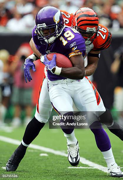 Ifeanyi Ohalete of the Cincinnati Bengals tackles Troy Williamson of the Minnesota Vikings during the NFL game on September 18, 2005 at Paul Brown...