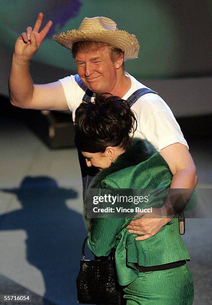Donald Trump and Actress Megan Mullally perform the Green Acres Theme onstage at the 57th Annual Emmy Awards held at the Shrine Auditorium on...