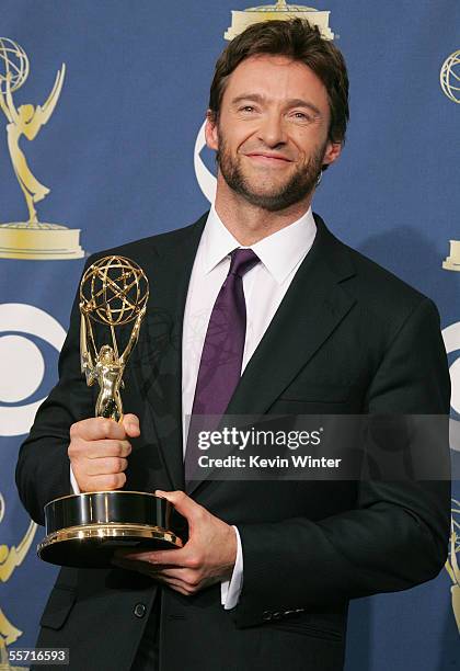 Actor Hugh Jackman poses with his Emmy for Outstanding Individual Performance in a Variety or Music Program in the press room at the 57th Annual Emmy...