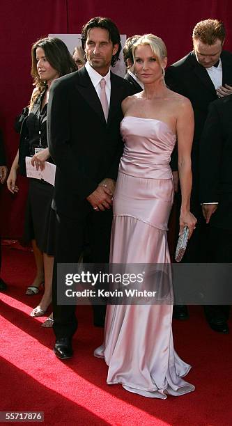 Actress Nicollette Sheridan and fiance Nick Soderblom arrive at the 57th Annual Emmy Awards held at the Shrine Auditorium on September 18, 2005 in...