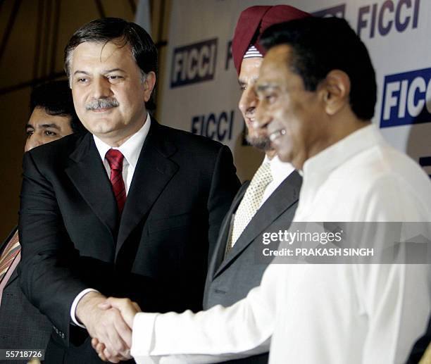 Indian Commerce & Industry Minister Kamal Nath shakes hands with Pakistan Commerce Minister Humayun Akhtar Khan during a meeting in New Delhi, 19...