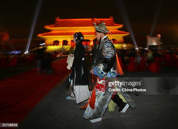 An actress and actor of Beijing Opera prepare for their performance during an evening held to mark the Mid-autumn Festival at the Forbidden City on...