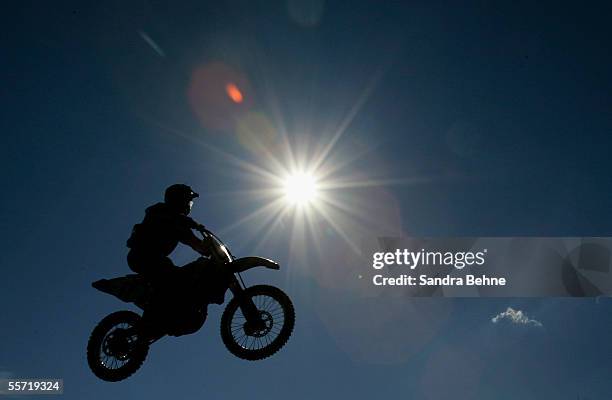 Motorbike is seen silhouetted silhouetted during the Moto Cross side car World Cup Final at the Rudersberg race track on September 18, 2005 in...