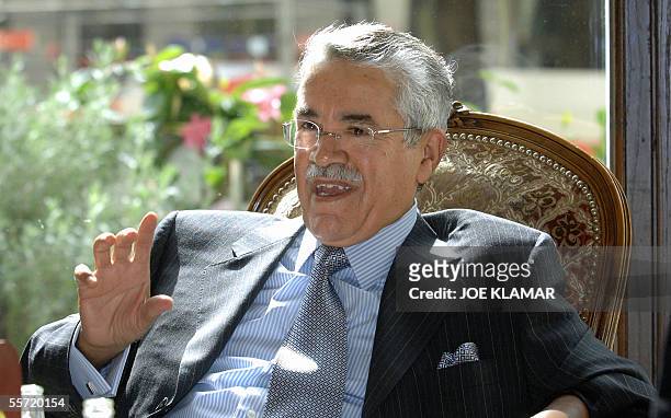 Saudi Arabia's minister of petroleum and mineral resources Ali Al-Naimi speaks with members of his delegation prior to a lunch with non-OPEC members...