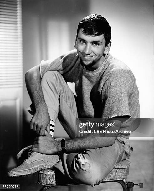 American actor Bob Denver sits on a stool as he poses in character as the freaky beatnik Maynard G. Krebs from the television situation comedy 'The...