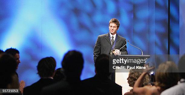 Ben Cousins of the Eagles stands on stage wearing the 2005 Brownlow Medal after being announced as the winner during the West Coast Eagles Brownlow...