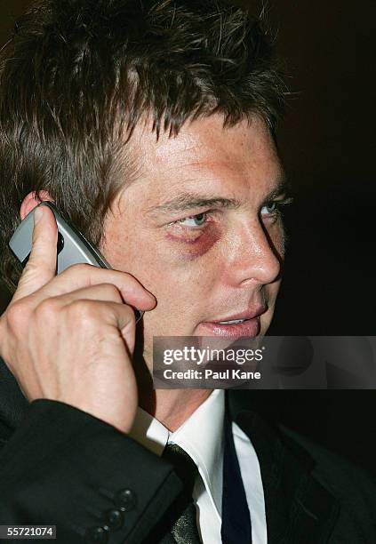 Ben Cousins of the Eagles receives a congratulatory phone call after being announced as the winner of the 2005 Brownlow Medal during the West Coast...