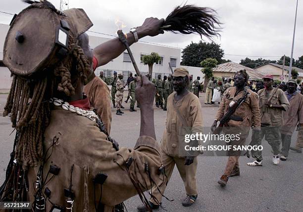 Dozo hunters march through the city of Bouake 19th September 2005 to mark the third anniversary of the beginning of the Ivory Coast crisis. The New...