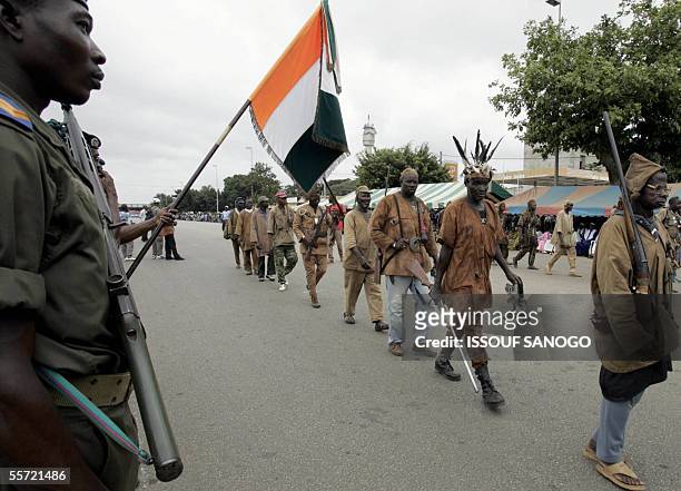 Traditional hunters, the Dozo, who fight alongside The New Forces march through the city of Bouake 19th September 2005 to mark the third anniversary...