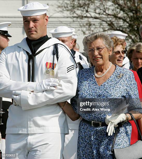 Princess Astrid of Norway is escorted by a sailor as she attends a reenactment of the 1942 ceremony in which the U.S. Handed over a ship to the Royal...