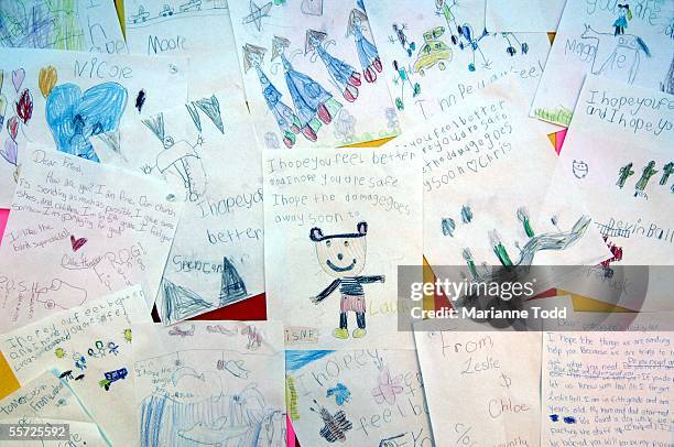 Letters from children are hung outside a mass feeding tent in a K-Mart parking lot September 19, 2005 in Waveland, Mississippi. Rescue and clean up...