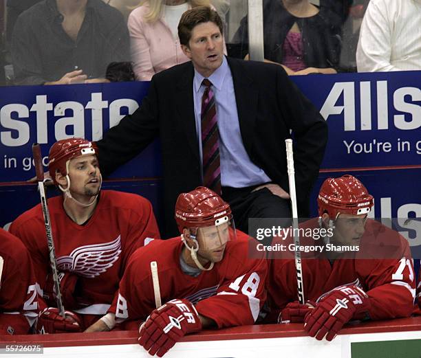 Mike Babcock, the new head coach of the Detroit Red Wings, looks on from behind the bench during a preseason NHL game against the Tampa Bay Lightning...