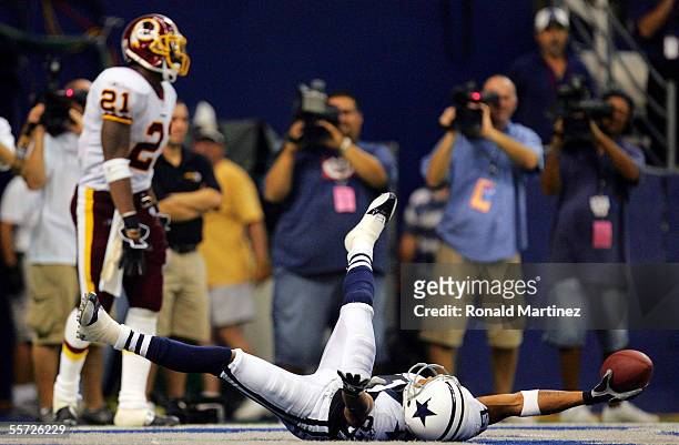 Wide receiver Terry Glenn of the Dallas Cowboys celebrates a touchdown in front of Sean Taylor of the Washington Redskins on September 19, 2005 at...