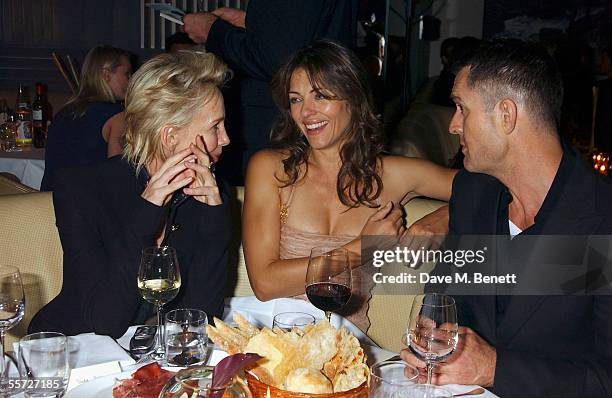 Trudie Styler, Elizabeth Hurley and Rupert Everett attends the afterparty dinner for the Versace London store relaunch, at Locatelli on September 19,...