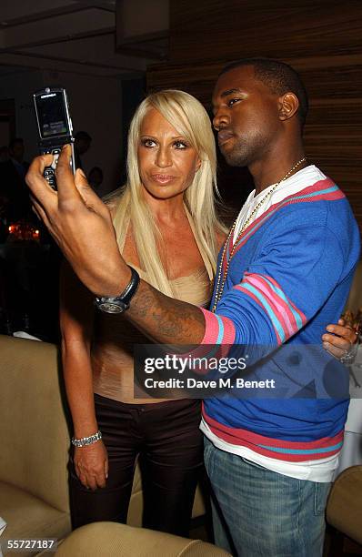 Donatella Versace and Kanye West attends the afterparty dinner for the Versace London store relaunch, at Locatelli on September 19, 2005 in London,...