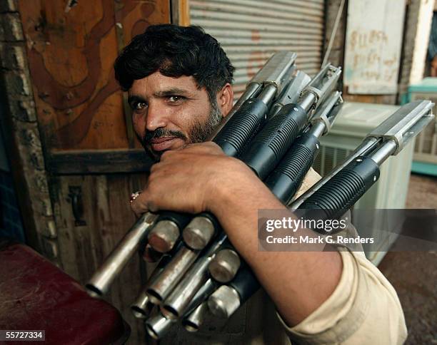 Pashtun tribal man carries arm parts on August 9, 2005 in Darra Adam Khel, Pakistan. The Afridi of Darra Adam Khel clan is the tribal areas'...