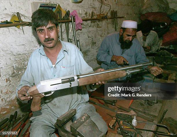 Pashtun tribal man makes arms on August 9, 2005 in Darra Adam Khel, Pakistan. The Afridi of Darra Adam Khel clan is the tribal areas' homegrown...