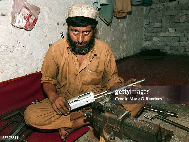 Pashtun tribal man makes arms on August 9, 2005 in Darra Adam Khel, Pakistan. The Afridi of Darra Adam Khel clan is the tribal areas' homegrown...