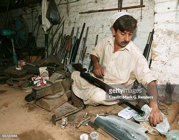 Pashtun tribal man makes arms on August 9, 2005 in Darra Adam Khel, Pakistan. The Afridi of Darra Adam Khel clan is the tribal areas' homegrown...