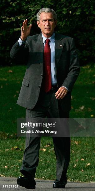 President George W. Bush waves as he walks towards Marine One prior to his departure from the White House September 20, 2005 in Washington, DC....