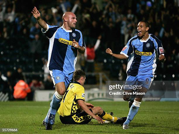 Tommy Mooney of Wycombe Wanderers celebrates his goal with team mate Nathan Tyson during the Carling Cup second round match between Wycombe Wanderers...