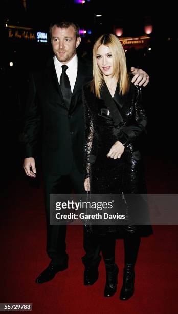 Singer Madonna and her husband, director Guy Ritchie, arrive at the UK Premiere of "Revolver" at the Odeon Leicester Square on September 20, 2005 in...