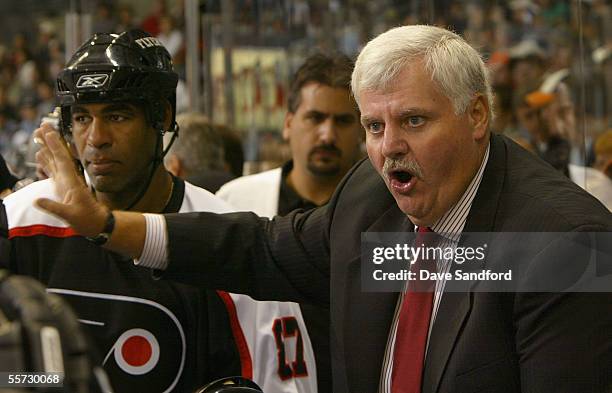 Head coach Ken Hitchcock of the Philadelphia Flyers directs his team against the Atlanta Thrashers during the preseason NHL game at the John Labatt...