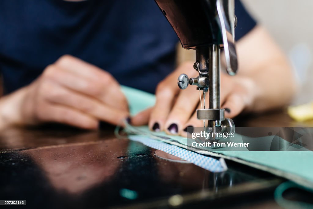 Young Fashion Designer Working On Sewing Machine