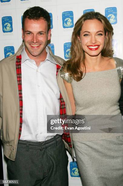 Actress Angelina Jolie and her ex-husband Jonny Lee Miller attend a special screening of the film "Peace One Day" at the Ziegfeld Theater September...