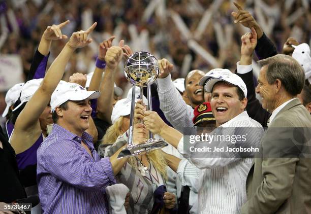 Owners Gavin Maloof , Joe Maloof and head coach John Whisenant of the Sacramento Monarchs celebrate after defeating the Connecticut Sun during Game 4...
