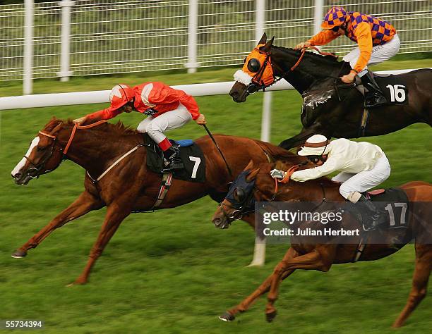 Frankie Dettori and Beaver Patrol lead the Eddie Ahern ridden Coconut Squeak and the Alan Munro partnered Swinbrook home to land The Helen Rix Stakes...