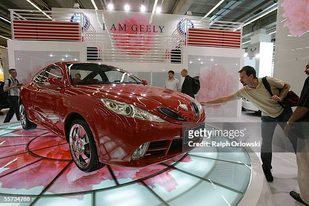 Visitors look at the Chinese manufactured Geely "CD" at the International Auto Show September 21, 2005 in Frankfurt, Germany. About a thousand...