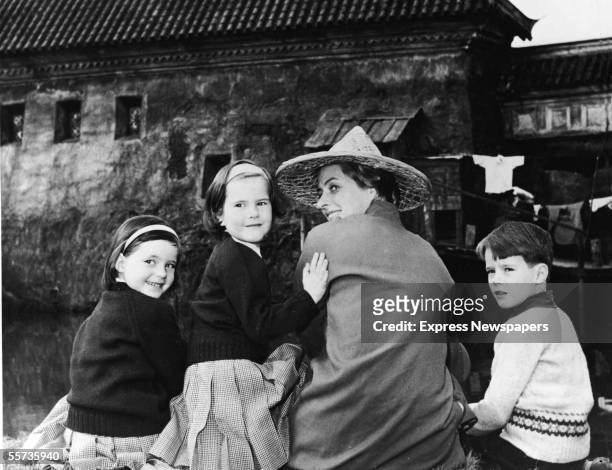 The children of Swedish-born actress and Italian director Roberto Rosssellini sit with their mother and turn back to the camera as they visit her on...