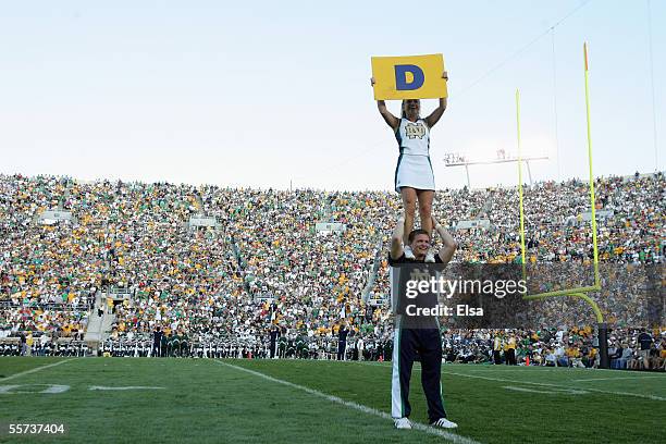 The Notre Dame Fighting Irish cheerleaders perform during the game with the Michigan State Spartans on September 17, 2005 at Notre Dame Stadium in...