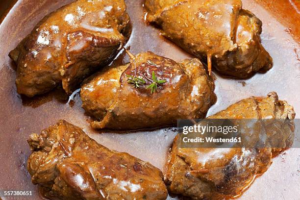 beef roulades with sauce in pot - beef roulade stock pictures, royalty-free photos & images