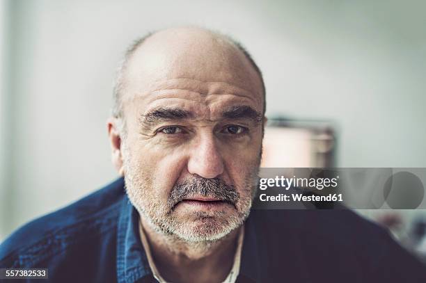 portrait of serious looking senior man - surprised eyes stock pictures, royalty-free photos & images