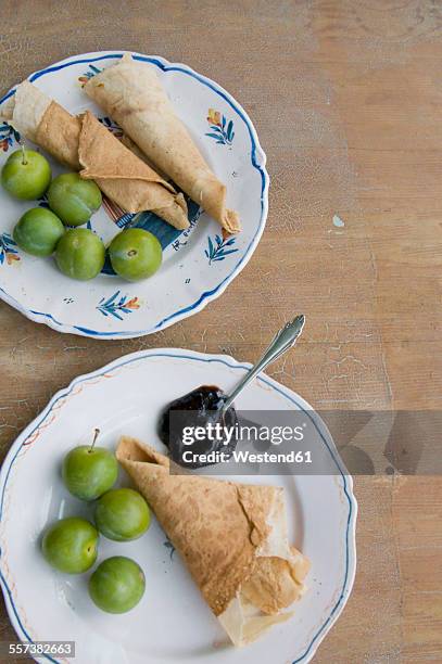 plates with crepes, compote and greengages - greengage stock pictures, royalty-free photos & images