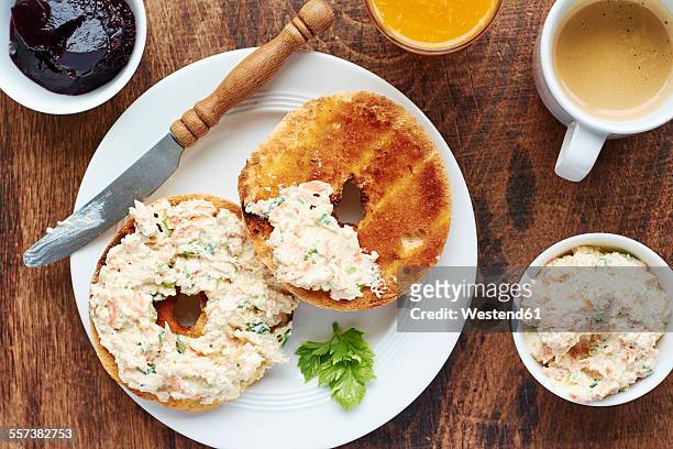 breakfast table with bagles and a home made vegetable spread - bagels stock pictures, royalty-free photos & images