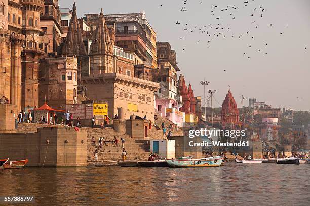 india, uttar pradesh, varanasi, ghats, boats and ganges river - ワーラーナシー市 ストックフォトと画像