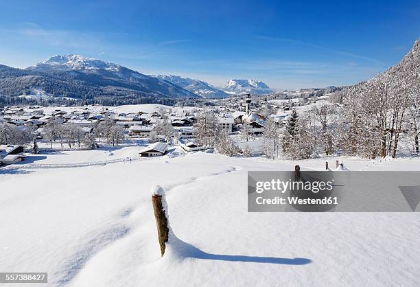 germany, bavaria, upper bavaria, chiemgau, view to reit im winkl in winter, unterberghorn and kaiser mountains in the background - kaiser fotografías e imágenes de stock