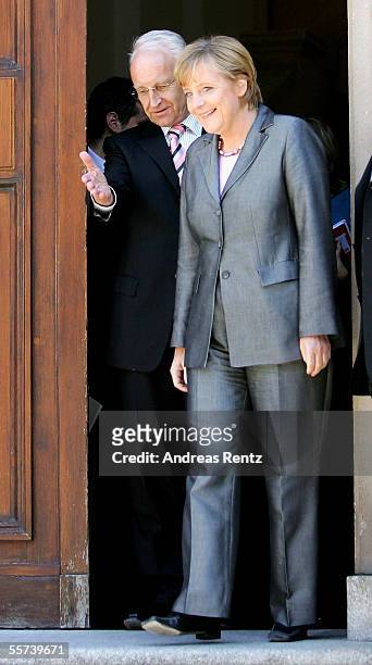 Angela Merkel, chancellor candidate of the Christian Democratic Union and Edmund Stoiber , governor of Bavaria and leader of the CSU, leave a meeting...